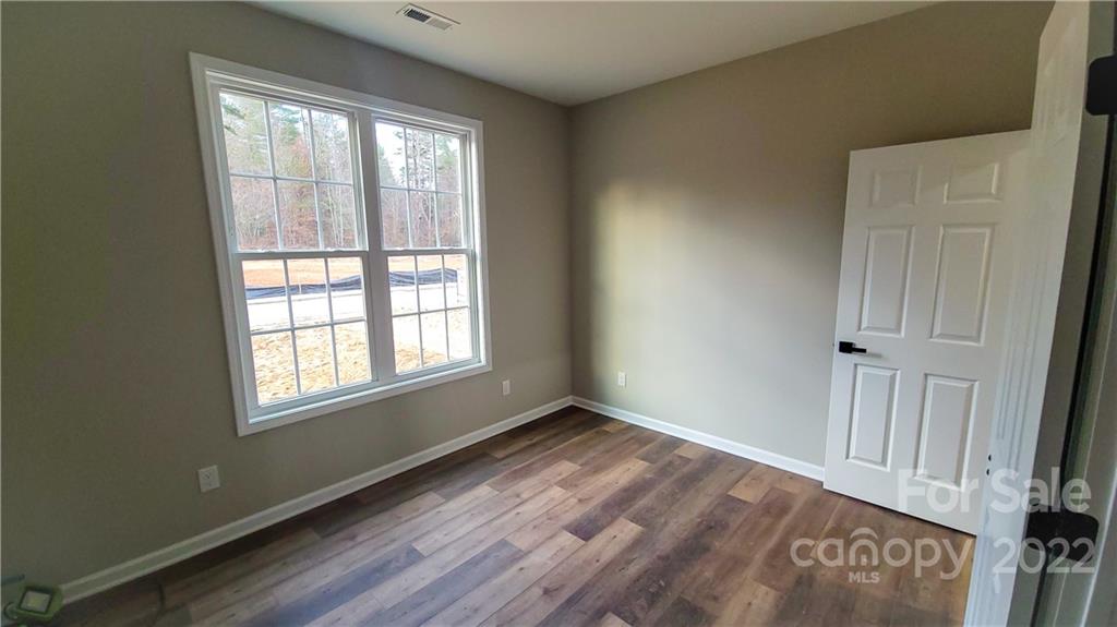 152 Eagles Landing Morganton, NC 28655 - Photo 23 of 27 a view of an empty room with a window