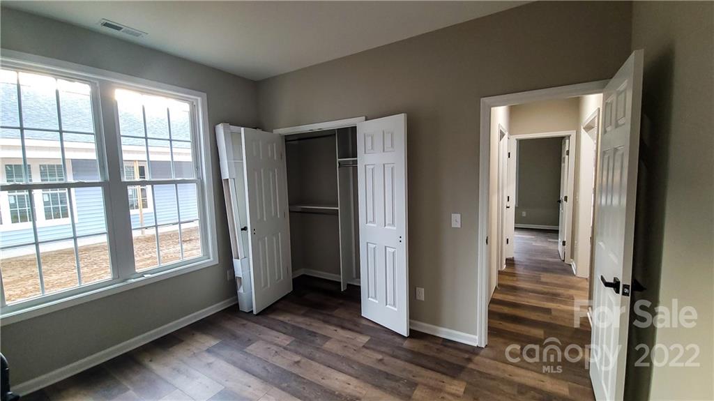 152 Eagles Landing Morganton, NC 28655 - Photo 24 of 27 a view of a hallway with wooden floor and windows