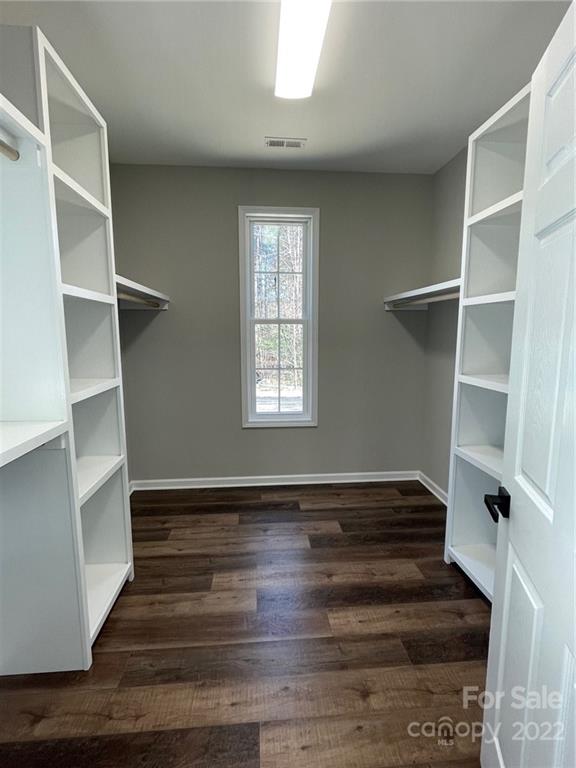 152 Eagles Landing Morganton, NC 28655 - Photo 26 of 27 a view of an empty room with wooden floor and a window
