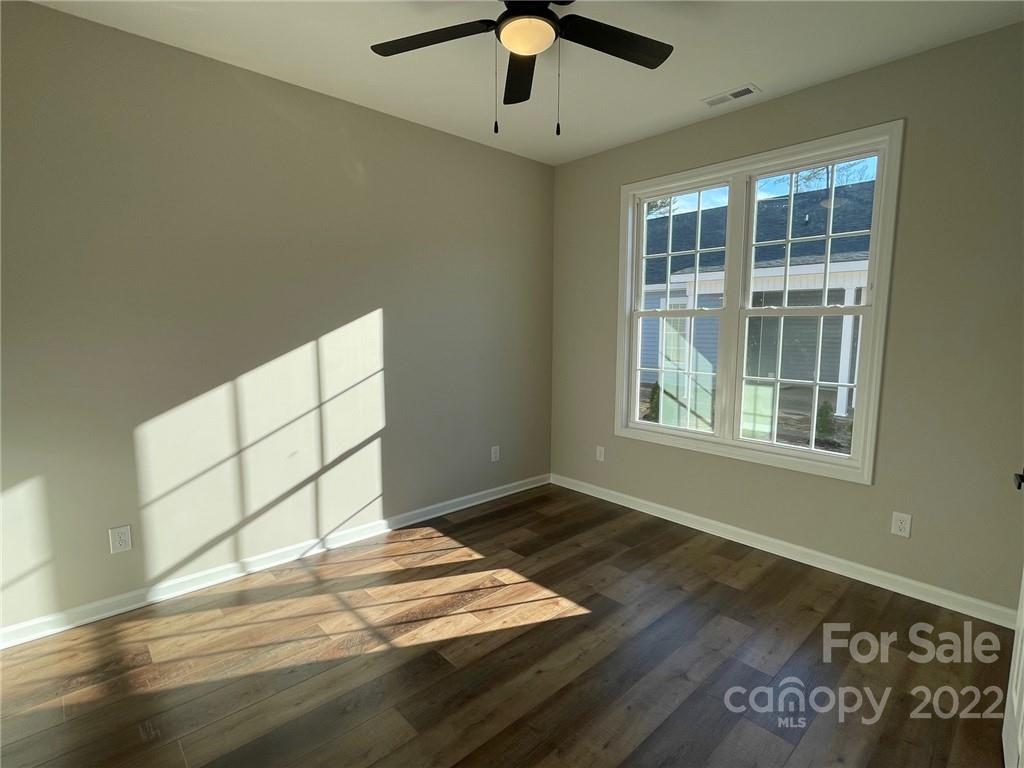 152 Eagles Landing Morganton, NC 28655 - Photo 27 of 27 a view of wooden floor and windows in a room
