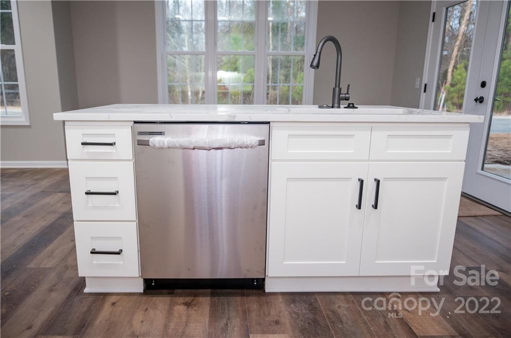 152 Eagles Landing Morganton, NC 28655 - Photo 9 of 27 a view of granite countertop white cabinets with wooden floor