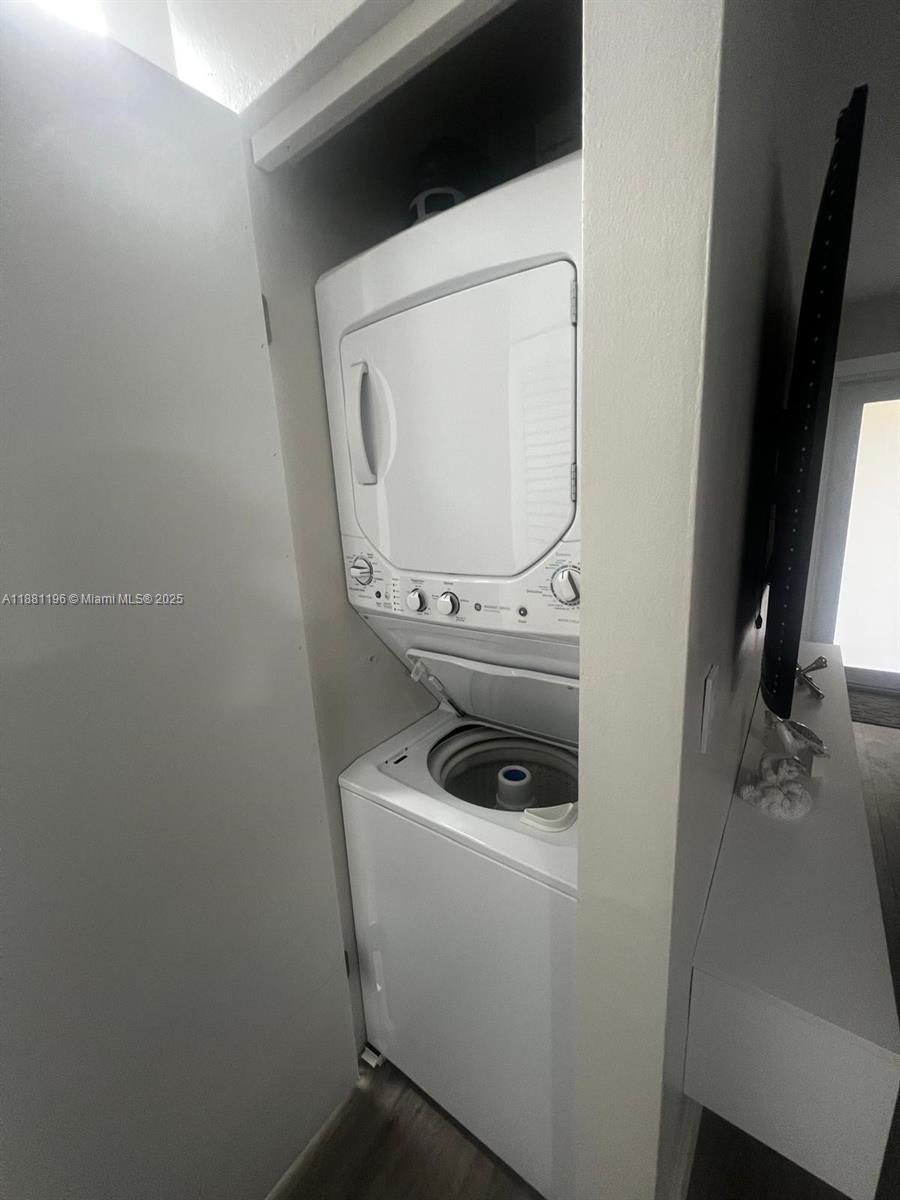 222 Southwest 8th Street, Unit A Dania Beach, FL 33004 - Photo 11 of 16 a utility room with dryer and washer