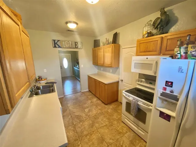 a bathroom with a sink a mirror and a shower
