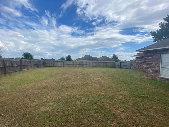a view of a lake with a big yard
