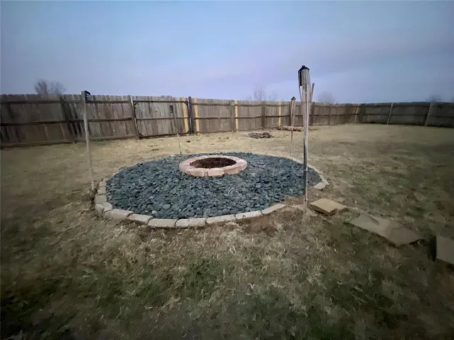 a view of a swimming pool with a yard