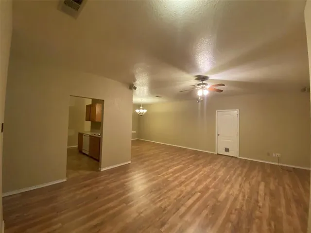 a view of a livingroom with wooden floor