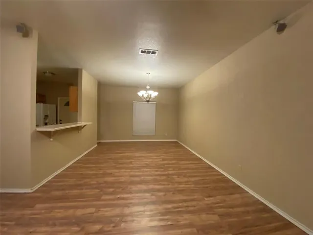 a kitchen with a sink stove and refrigerator