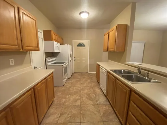 a bathroom with a toilet a sink and bathtub