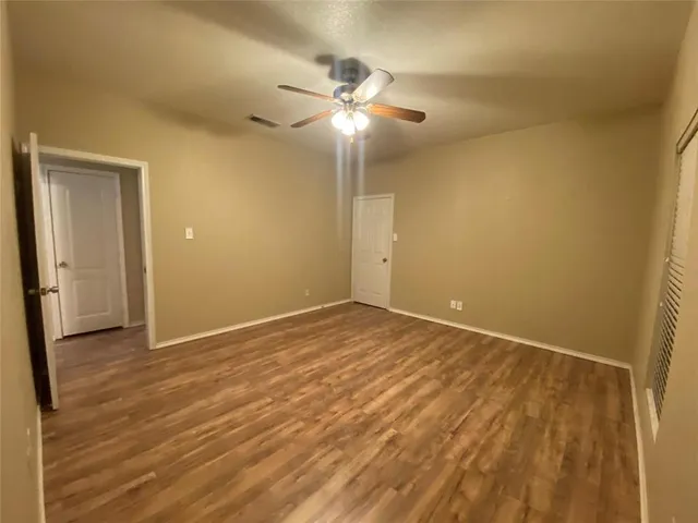 a bathroom with a sink a toilet a mirror and shower