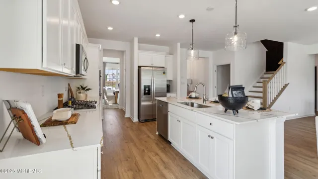 a living room with fireplace furniture and a large window