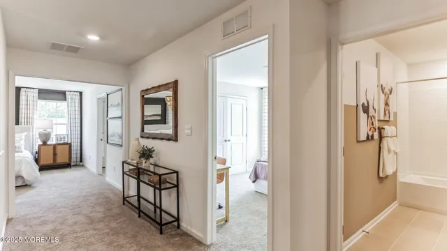 a bathroom with a double vanity sink and mirror