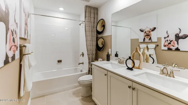 a spacious bathroom with a shower sink and mirror