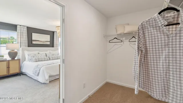a bedroom with a bed and cabinets