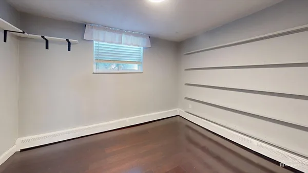 a view of an empty walk in closet
