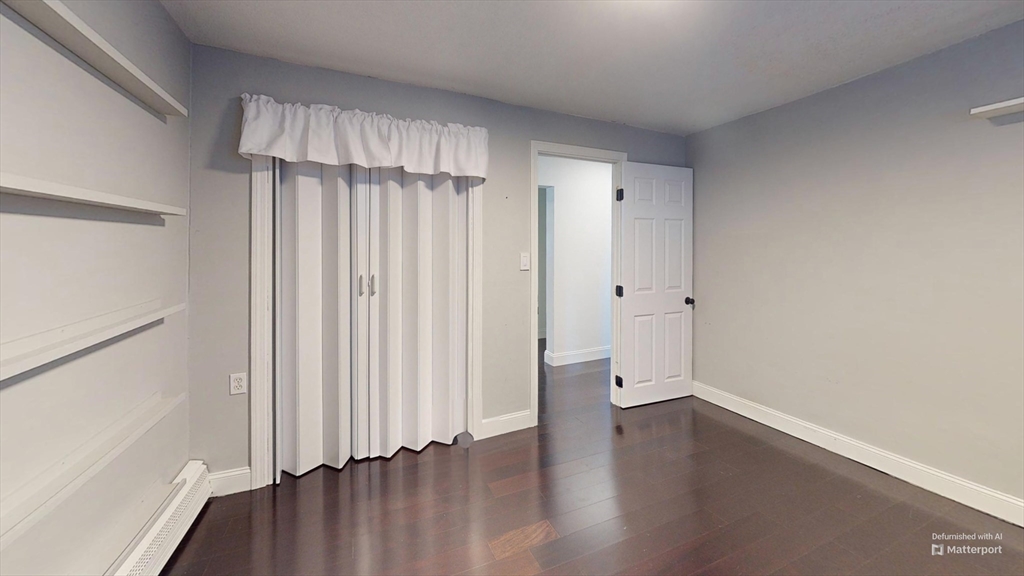31 Westgate Road, Unit 1 Boston, MA 02467 - Photo 5 of 10 a view of a room with wooden floor