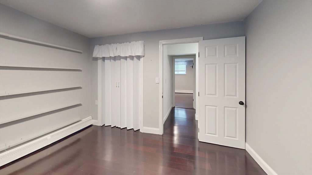 31 Westgate Road, Unit 1 Boston, MA 02467 - Photo 8 of 10 a view of a room with wooden floor