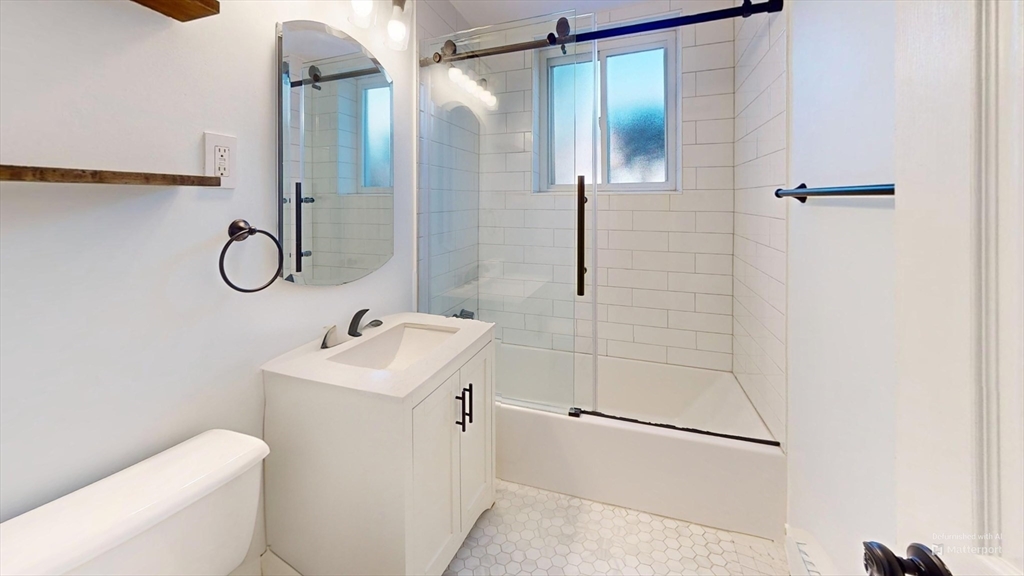 31 Westgate Road, Unit 1 Boston, MA 02467 - Photo 9 of 10 a bathroom with a sink toilet and shower