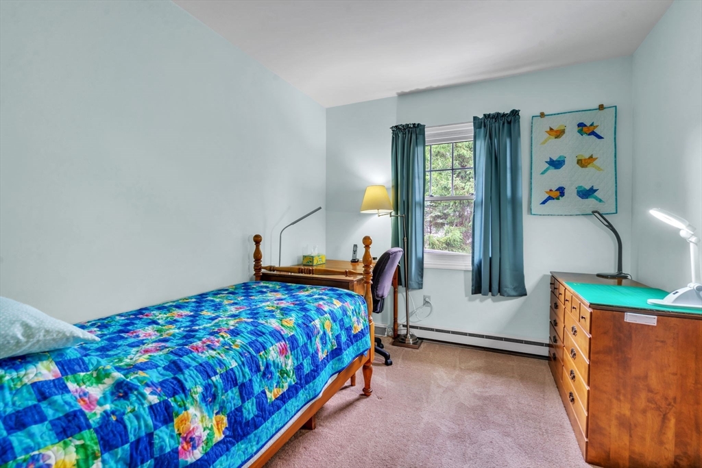 2018 Central Street Three Rivers, MA 01080 - Photo 17 of 42 a bedroom with a bed and a table in it