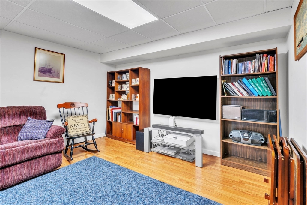 2018 Central Street Three Rivers, MA 01080 - Photo 26 of 42 a living room with furniture and a flat screen tv