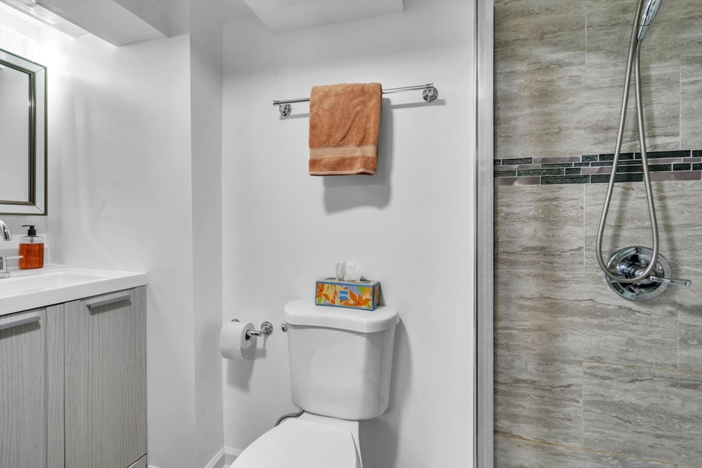 2018 Central Street Three Rivers, MA 01080 - Photo 34 of 42 a bathroom with a toilet and a shower curtain