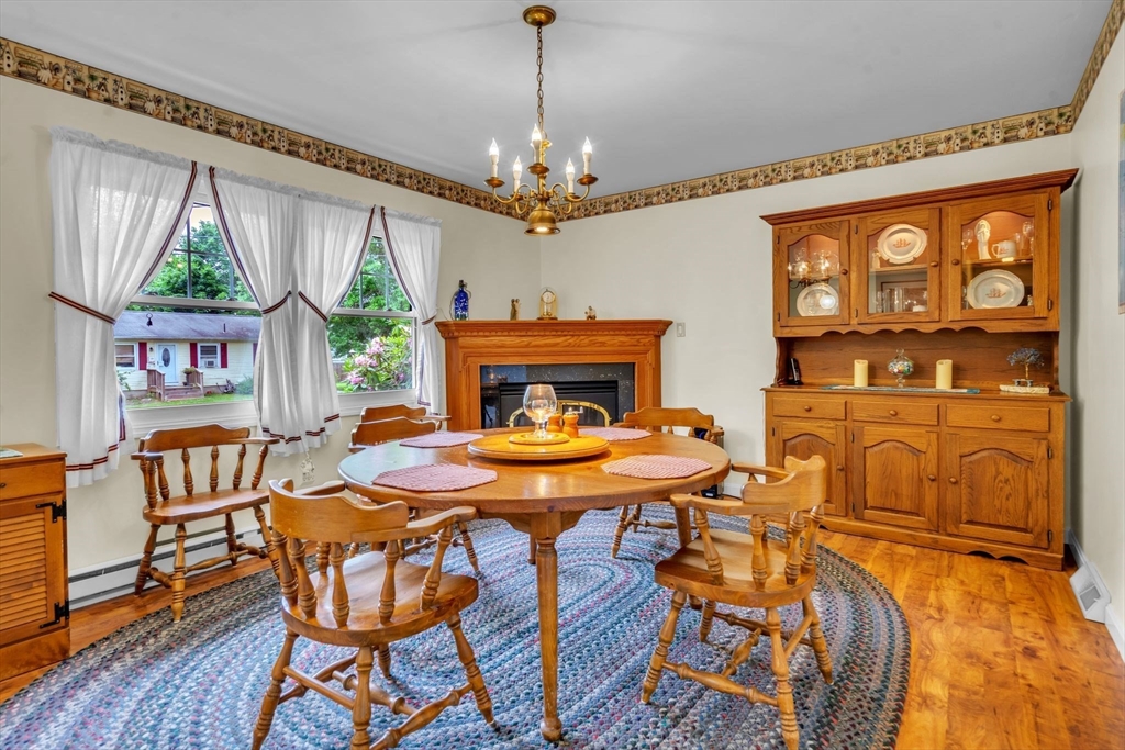 2018 Central Street Three Rivers, MA 01080 - Photo 5 of 42 a view of a dining room with furniture a chandelier and wooden floor