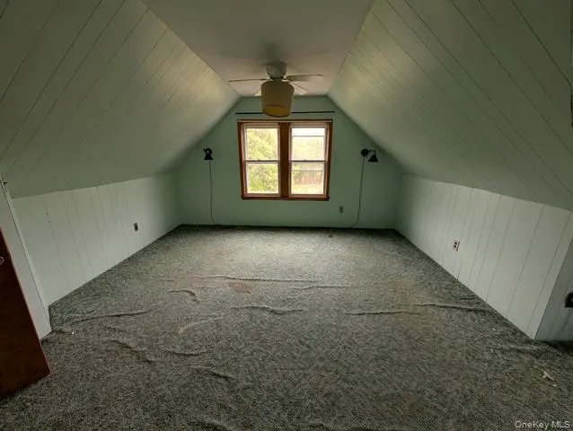 an empty room with a empty space and windows