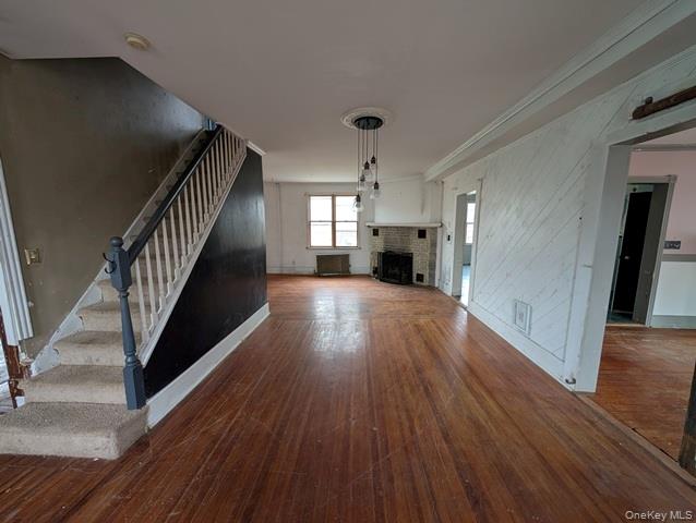 398 Angola Road Cornwall, NY 12518 - Photo 3 of 12 a view of a hallway with wooden floor and stairs