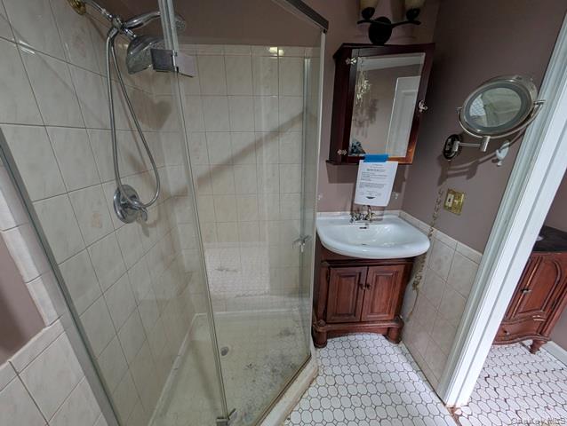 398 Angola Road Cornwall, NY 12518 - Photo 8 of 12 a bathroom with a sink a mirror and shower