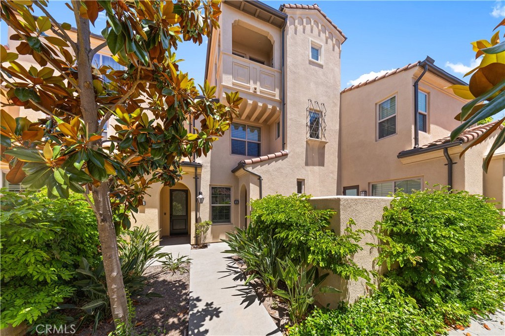 front view of a house with a tree