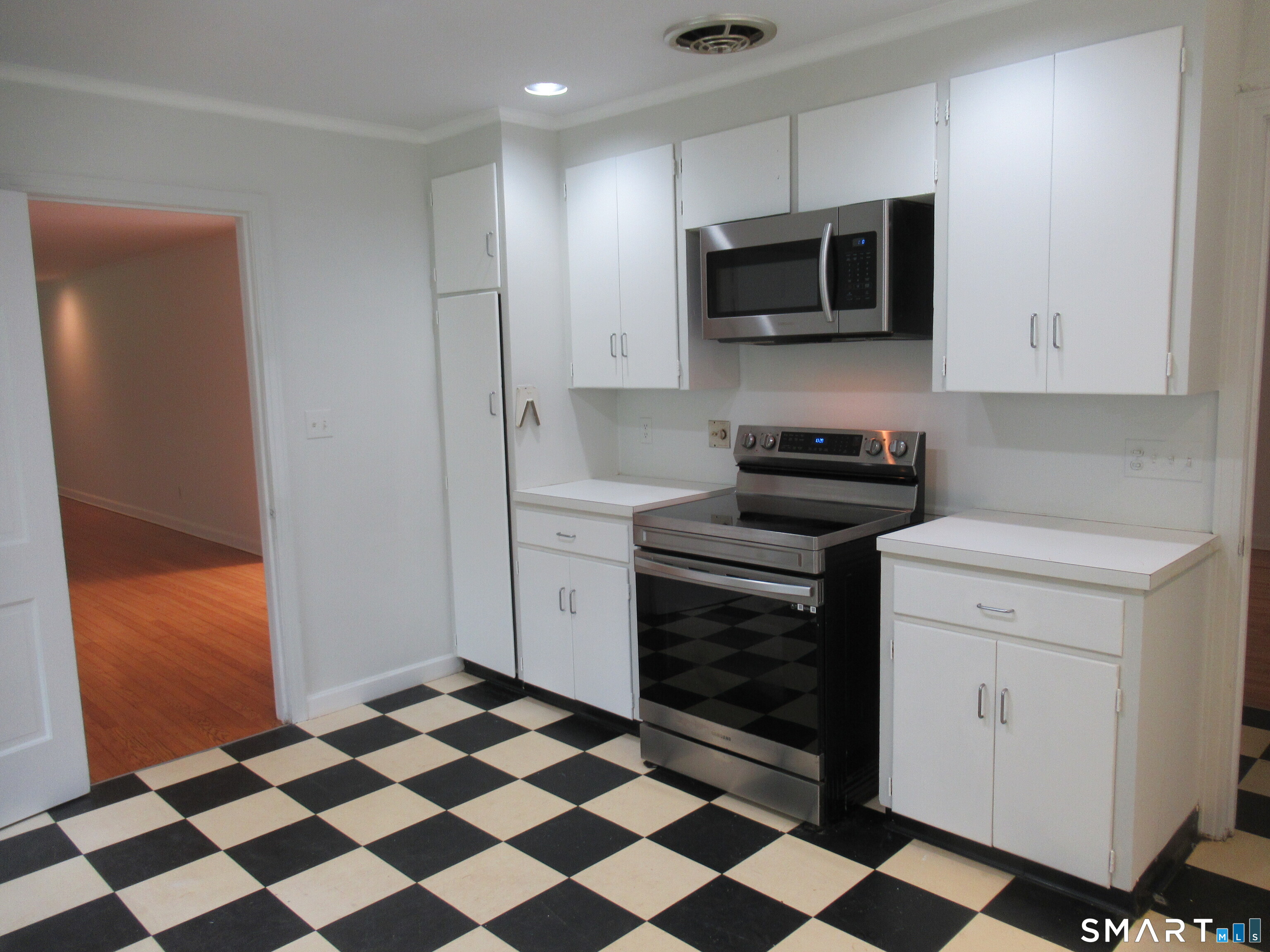 11 Burnt Swamp Road Woodbridge, CT 06525 - Photo 11 of 29 a kitchen with a sink a stove and refrigerator