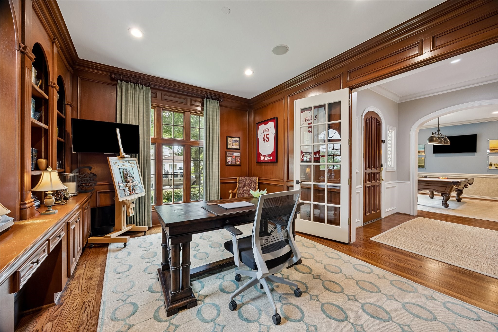 6358 Auden Street Houston, TX 77005 - Photo 6 of 50 The study has a beautiful treed view of Auden. Large double French glass doors can be closed for privacy.