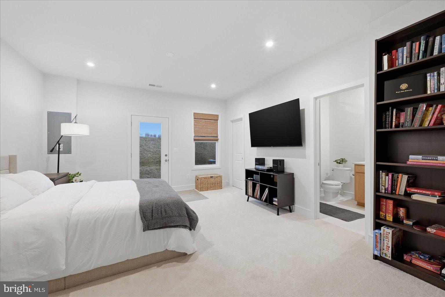 121 Checkerspot Way White Post, VA 22663 - Photo 12 of 65 a bedroom with a bed and a flat screen tv