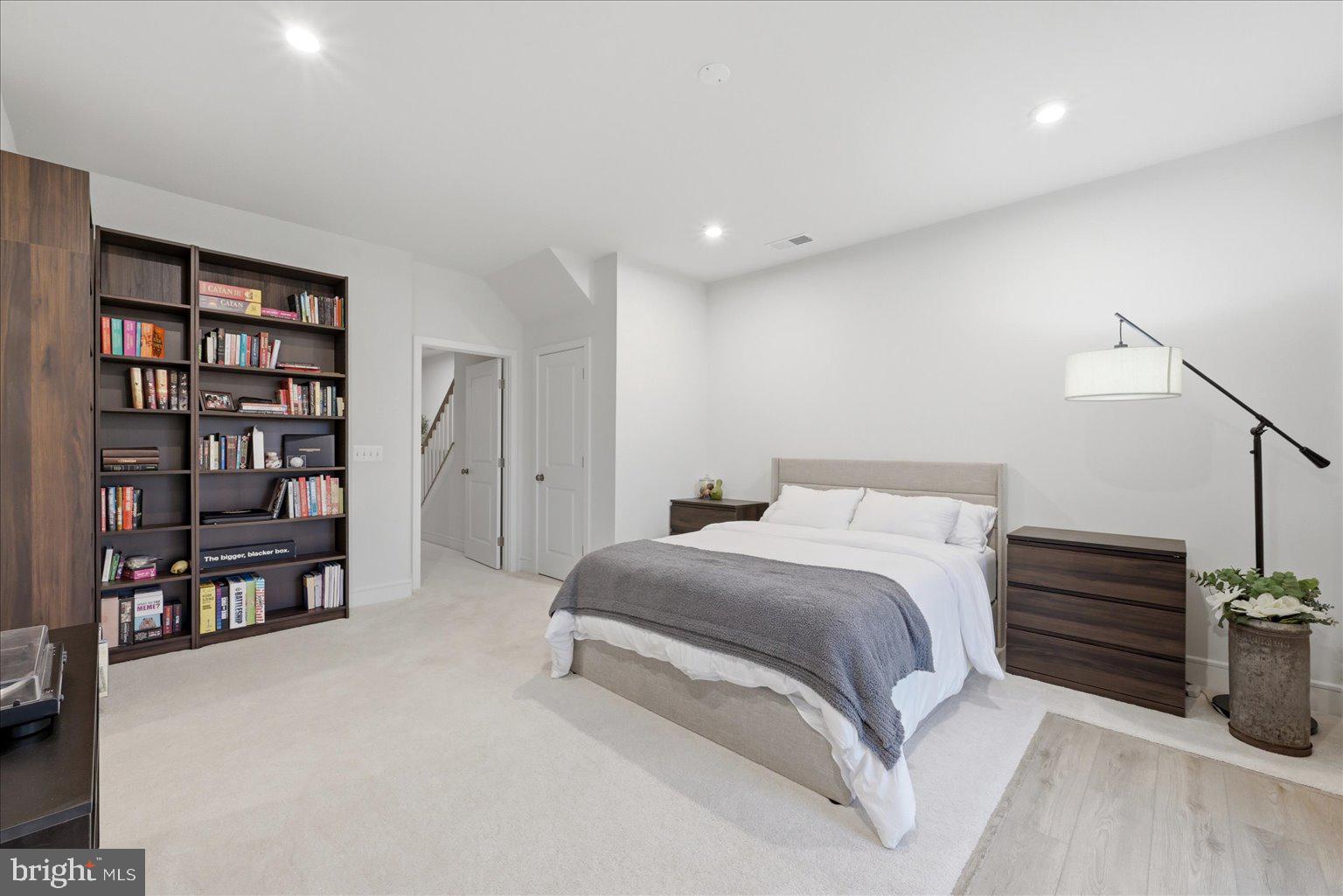 121 Checkerspot Way White Post, VA 22663 - Photo 13 of 65 a spacious bedroom with a bed and a book shelf