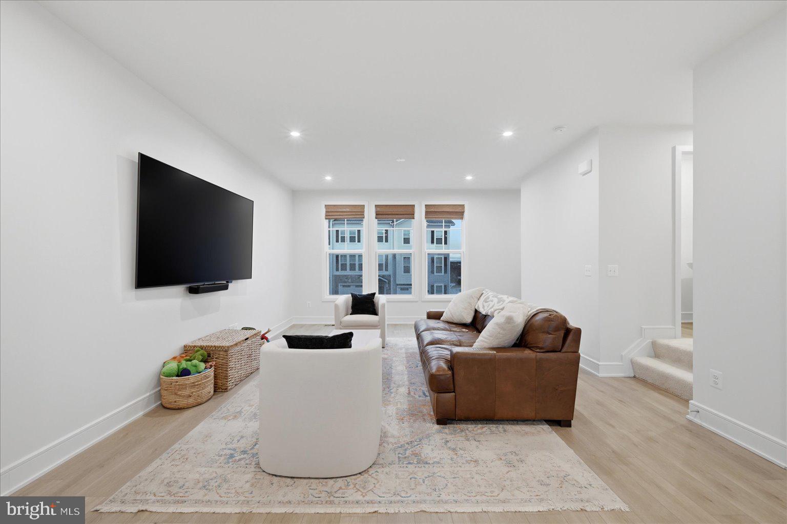 121 Checkerspot Way White Post, VA 22663 - Photo 16 of 65 a living room with furniture and a flat screen tv