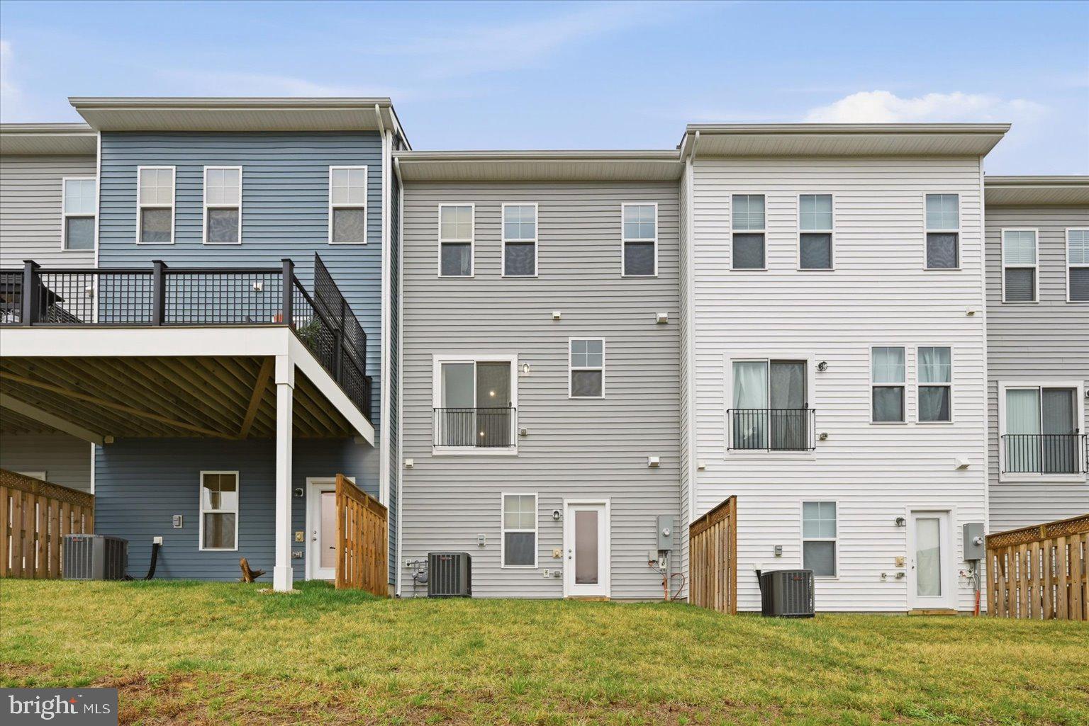 121 Checkerspot Way White Post, VA 22663 - Photo 35 of 65 a view of a brick house with many windows and a yard