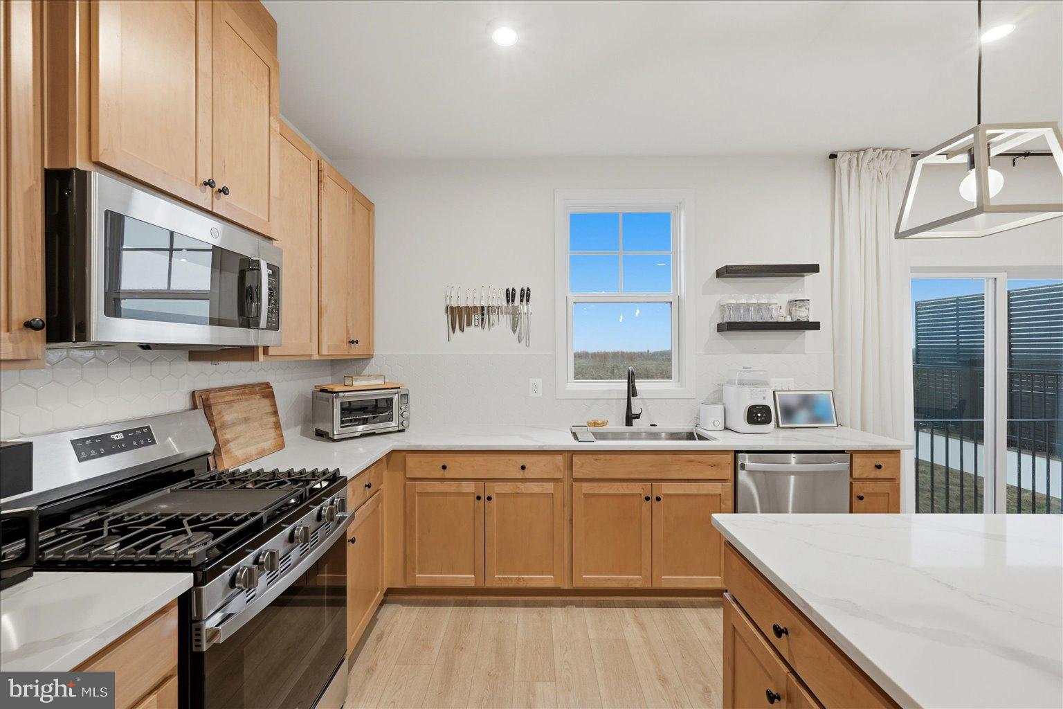 121 Checkerspot Way White Post, VA 22663 - Photo 4 of 65 a kitchen with a sink stove top oven and cabinets