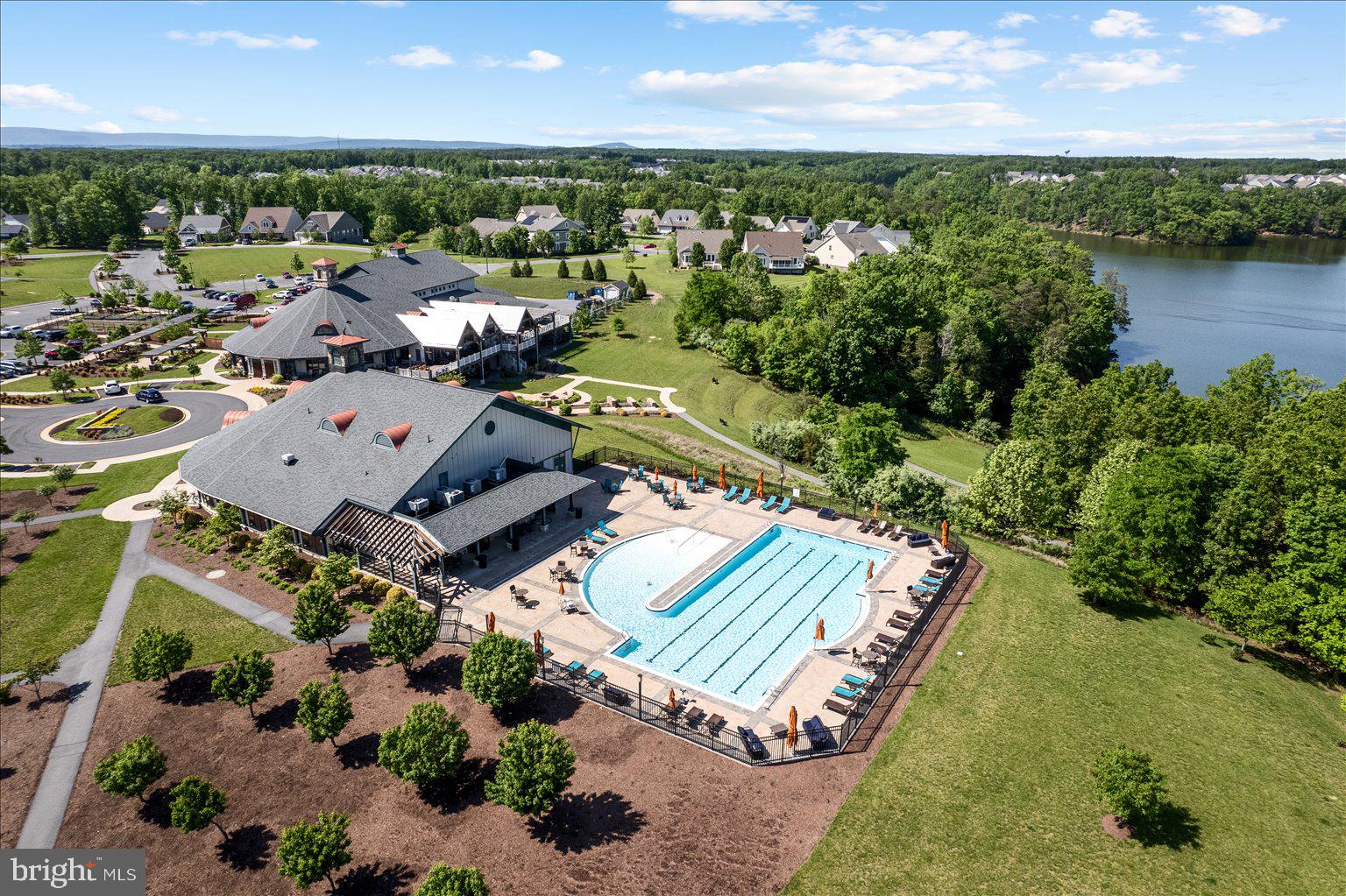 121 Checkerspot Way White Post, VA 22663 - Photo 41 of 65 an aerial view of a house with a garden and lake view