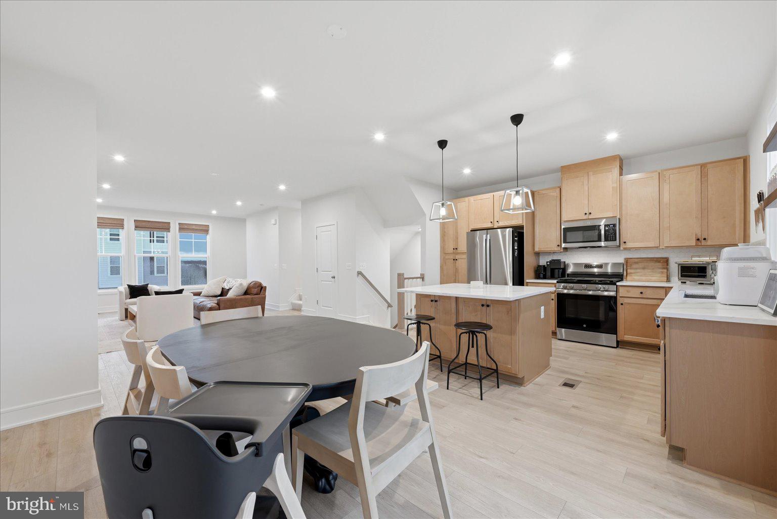 121 Checkerspot Way White Post, VA 22663 - Photo 6 of 65 a kitchen with a table chairs microwave and cabinets