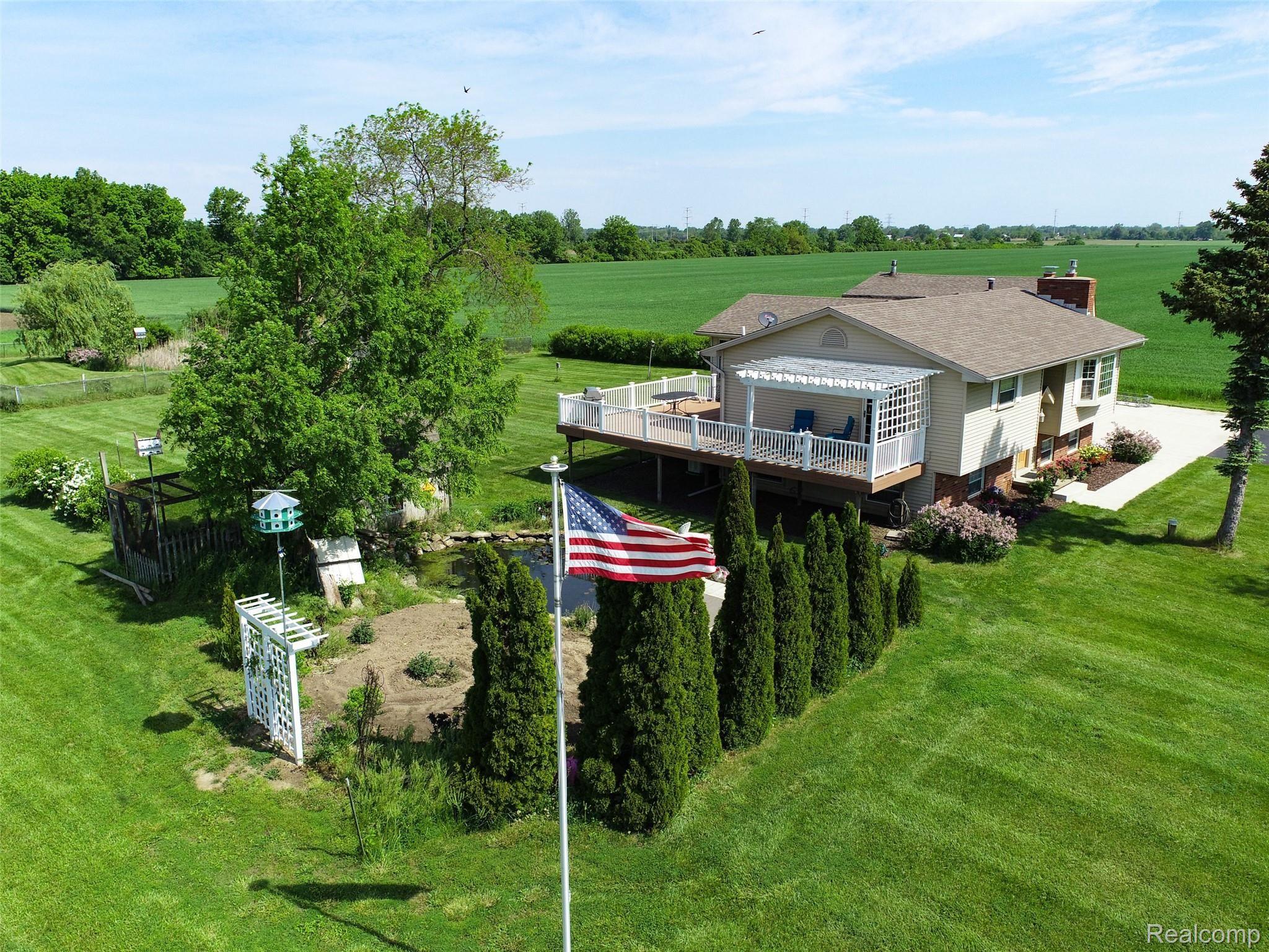 13133 Hull Road Monroe, MI 48161 - Photo 7 of 42 front side pic hull with flag .jpg