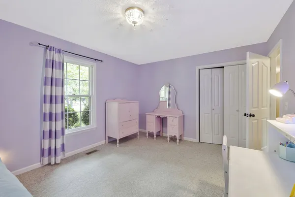 a view of a room with wooden floor windows and cabinet