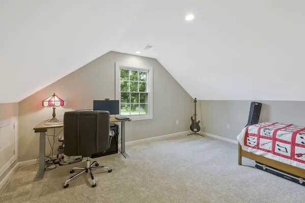 a workspace with furniture and a window