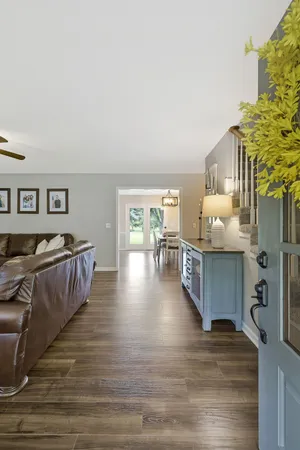 a view of living room kitchen and entryway