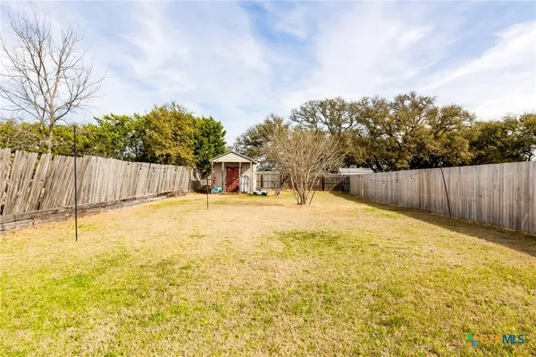a view of a house with basketball court