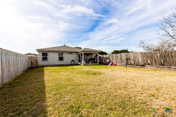 a house view with swimming pool