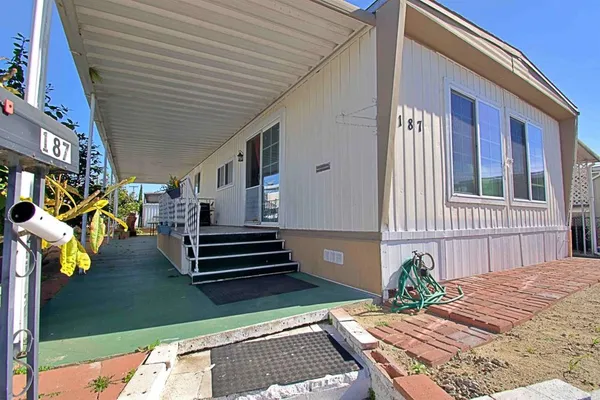 a front view of a house with stairs