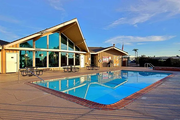 a view of a swimming pool with a lake from a corridor