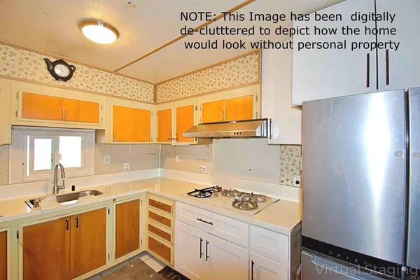 a kitchen with a sink stove and refrigerator
