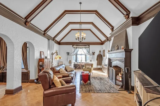 a living room with furniture and large windows