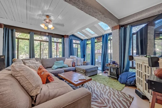 a bedroom with furniture and window