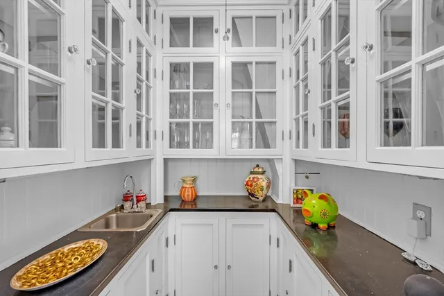 a view of a bedroom with wooden floor and stairs